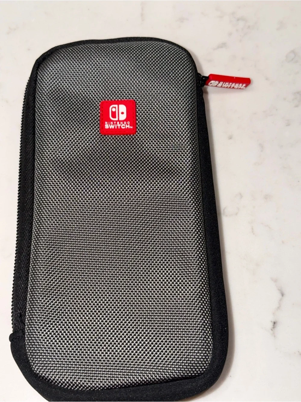 Nintendo Switch Gray Travel Case with Red Logo Accent